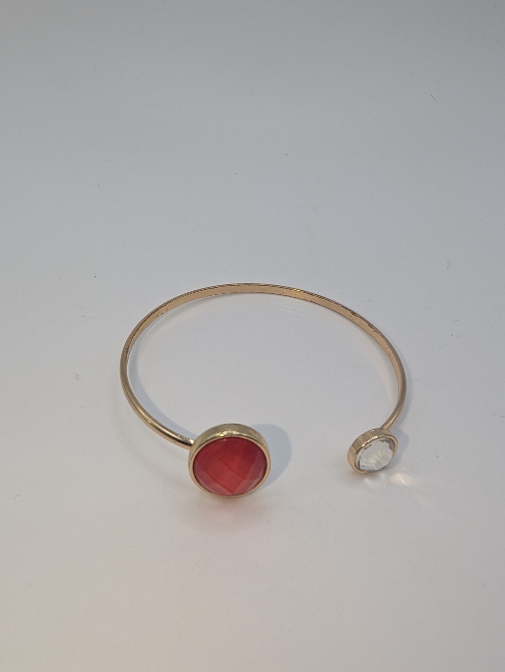 Gold Open Cuff Bracelet with Red Glass Accent and Clear Stone